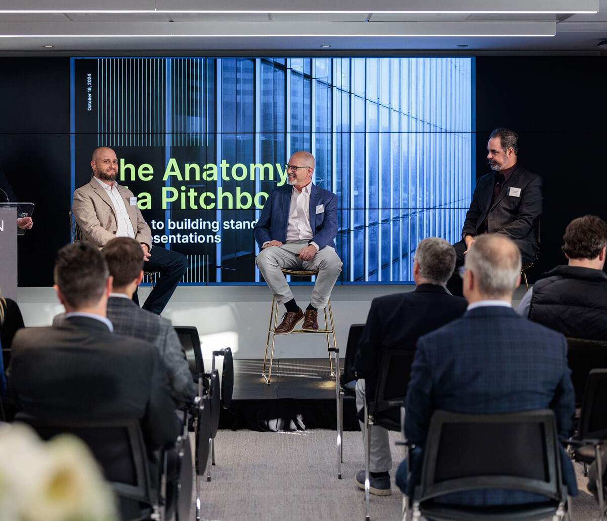 A panel discussion at Fasken titled "The Anatomy of a Pitchbook: Keys to Building Standout Presentations," featuring four speakers on stage in front of an audience.