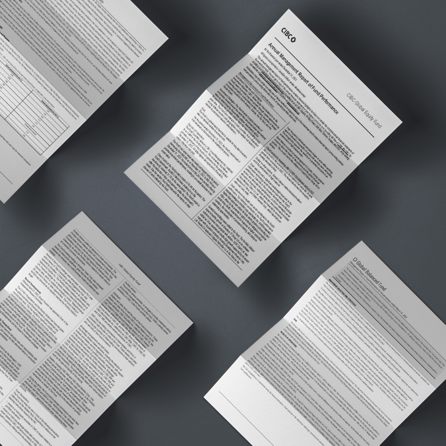 An image of several documents arranged on a dark surface, showcasing detailed content and professional formatting.